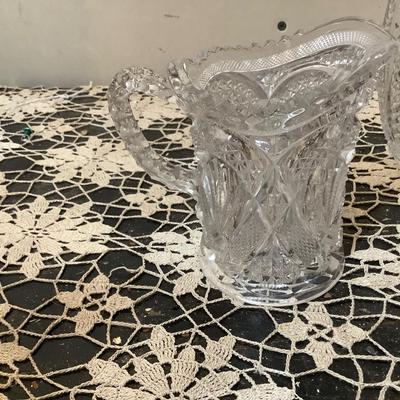 Sale Photo Thumbnail #271: You get a glass large covered jar with red ball decorations, crystal glass humidor, cut glass pitcher, crystal vase.