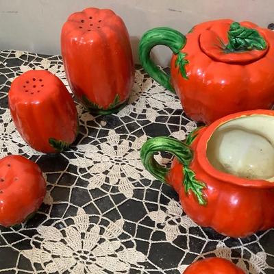 Sale Photo Thumbnail #326: Two smaller tea pots, two smaller pitcher, two larger glass one smaller glass three shakers, and salt and peppers