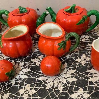 Sale Photo Thumbnail #328: Two smaller tea pots, two smaller pitcher, two larger glass one smaller glass three shakers, and salt and peppers