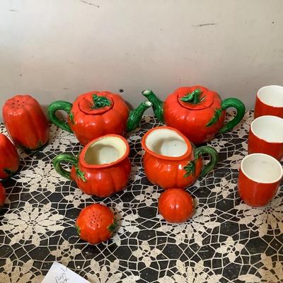 Sale Photo Thumbnail #324: Two smaller tea pots, two smaller pitcher, two larger glass one smaller glass three shakers, and salt and peppers