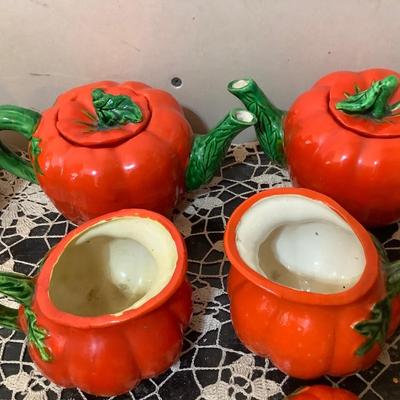 Sale Photo Thumbnail #325: Two smaller tea pots, two smaller pitcher, two larger glass one smaller glass three shakers, and salt and peppers