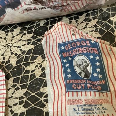 Sale Photo Thumbnail #14: Bag full of George Washington tobacco plugs cloth labels.