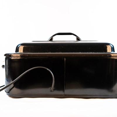 Sale Photo Thumbnail #59: It bakes, roast, slow cooks, steams, and keeps food warm. The temperatures are adjustable. The removable pan makes it easy for cleanup. It is large enough to cook a substantial turkey.