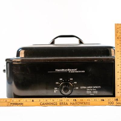 Sale Photo Thumbnail #61: It bakes, roast, slow cooks, steams, and keeps food warm. The temperatures are adjustable. The removable pan makes it easy for cleanup. It is large enough to cook a substantial turkey.