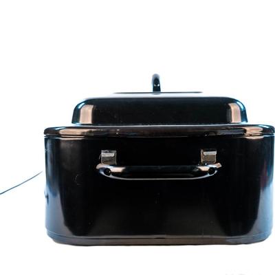 Sale Photo Thumbnail #58: It bakes, roast, slow cooks, steams, and keeps food warm. The temperatures are adjustable. The removable pan makes it easy for cleanup. It is large enough to cook a substantial turkey.