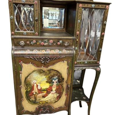 Sale Photo Thumbnail #401: Antique Hand-Painted French Victorian Style Cabinet W/ Glass Doors & Mirror
• Features intricate hand-painted designs and floral motifs
• Includes beveled mirror and glass-paneled doors
• Sturdy wood construction for durability
• Ample storage wit