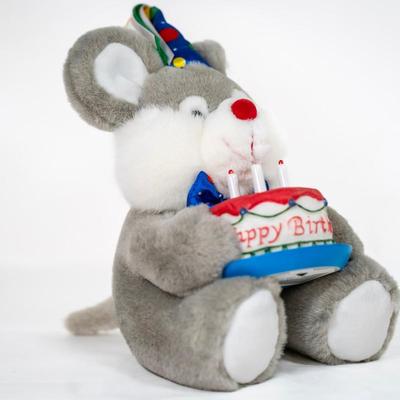 Sale Photo Thumbnail #179: Stuffed mouse with grey and white fur, large ears, and a red nose. Its wearing a colorful party hat and bow.