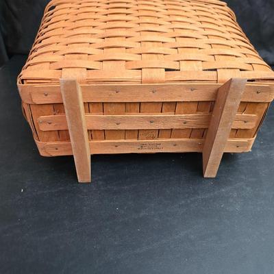 Longaberger footed magazine basket dated 1989 and signed by its weaver with wooden Pumpkin -