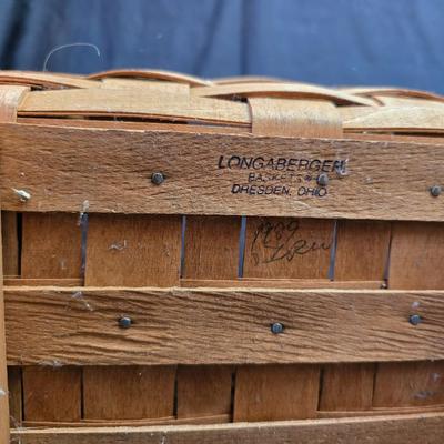 Longaberger footed magazine basket dated 1989 and signed by its weaver with wooden Pumpkin -