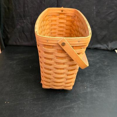 Longaberger footed magazine basket dated 1989 and signed by its weaver with wooden Pumpkin -