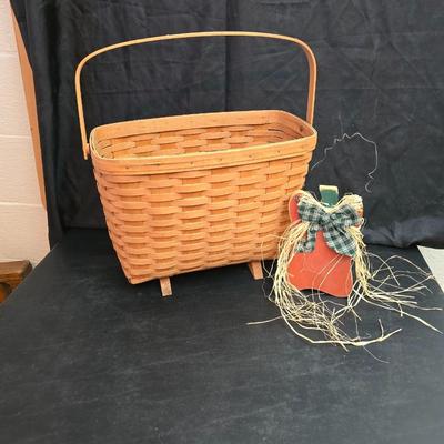 Longaberger footed magazine basket dated 1989 and signed by its weaver with wooden Pumpkin -