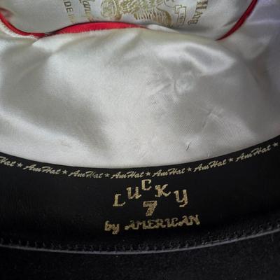 Black felt American Hat Company cowboy hat with a braided hatband with white tassels, with its original box. Size 7 1/4 comes with a hat...