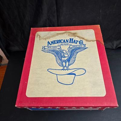 Black felt American Hat Company cowboy hat with a braided hatband with white tassels, with its original box. Size 7 1/4 comes with a hat...