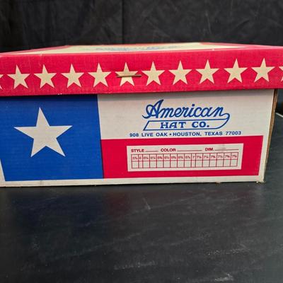 Black felt American Hat Company cowboy hat with a braided hatband with white tassels, with its original box. Size 7 1/4 comes with a hat...