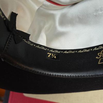 Black felt American Hat Company cowboy hat with a braided hatband with white tassels, with its original box. Size 7 1/4 comes with a hat...