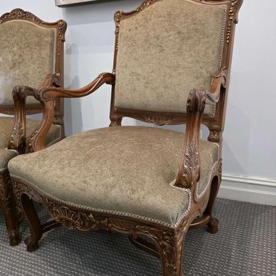 Sale Photo Thumbnail #46: Beautifully upholstered French carved Louis XV style accent chairs. Both chairs are immaculate. The touch of gold on the ornate carved wood with the natural earthy color upholstery is classic. 
You are bidding on the pair here, meaning you must pay for an