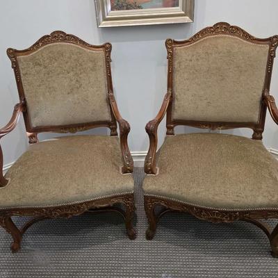 Sale Photo Thumbnail #45: Beautifully upholstered French carved Louis XV style accent chairs. Both chairs are immaculate. The touch of gold on the ornate carved wood with the natural earthy color upholstery is classic. 
You are bidding on the pair here, meaning you must pay for an