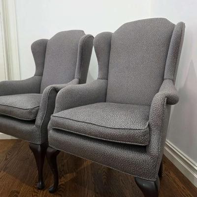 Sale Photo Thumbnail #58: Classic pair of custom upholstered armchairs with a modern twist. The gray textured upholstery feels and looks great with almost any decor. The chairs measure 27"W x 20"D x 42"H. Both are in excellent condition. You are bidding on the pair here meaning yo