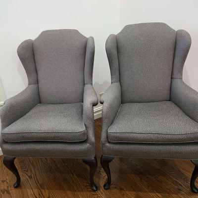 Sale Photo Thumbnail #59: Classic pair of custom upholstered armchairs with a modern twist. The gray textured upholstery feels and looks great with almost any decor. The chairs measure 27"W x 20"D x 42"H. Both are in excellent condition. You are bidding on the pair here meaning yo