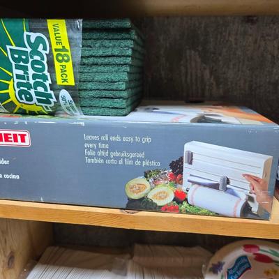 Large assortment of Kitchen must haves - bags - paper plates - plastic flatware and a Leifheit kitchen roll holder