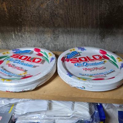 Large assortment of Kitchen must haves - bags - paper plates - plastic flatware and a Leifheit kitchen roll holder