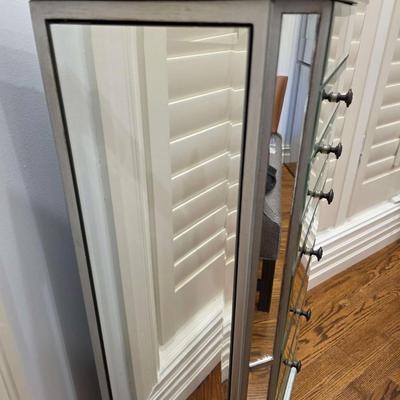 Sale Photo Thumbnail #69: This gorgeous, mirrored jewelry armoire will make a perfect gift for the holidays! The top lifts, the sides open and it has 7 drawers of varying sizes to accommodate all kinds of treasured jewels. This piece is in great condition and measures 32"H x 18"W 
