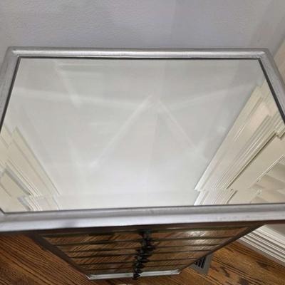 Sale Photo Thumbnail #70: This gorgeous, mirrored jewelry armoire will make a perfect gift for the holidays! The top lifts, the sides open and it has 7 drawers of varying sizes to accommodate all kinds of treasured jewels. This piece is in great condition and measures 32"H x 18"W 