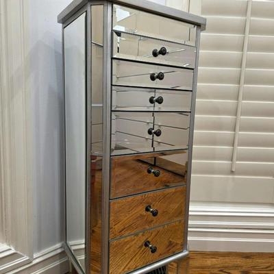 Sale Photo Thumbnail #75: This gorgeous, mirrored jewelry armoire will make a perfect gift for the holidays! The top lifts, the sides open and it has 7 drawers of varying sizes to accommodate all kinds of treasured jewels. This piece is in great condition and measures 32"H x 18"W 