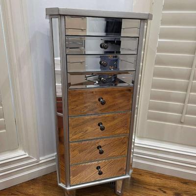 Sale Photo Thumbnail #67: This gorgeous, mirrored jewelry armoire will make a perfect gift for the holidays! The top lifts, the sides open and it has 7 drawers of varying sizes to accommodate all kinds of treasured jewels. This piece is in great condition and measures 32"H x 18"W 