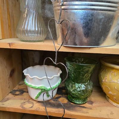 Large assortment of mostly ceramic garden pots, vases, with a new rain gauge and new Russco iii wind chime
