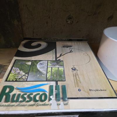 Large assortment of mostly ceramic garden pots, vases, with a new rain gauge and new Russco iii wind chime