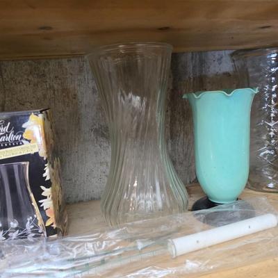 Large assortment of mostly ceramic garden pots, vases, with a new rain gauge and new Russco iii wind chime