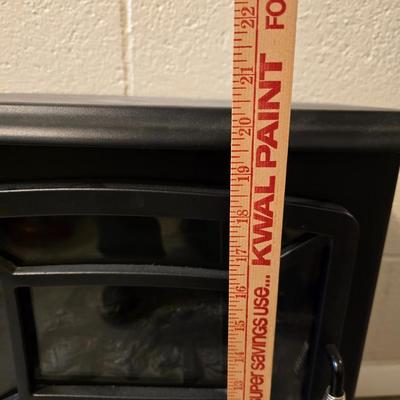 Working Space heater fireplace Model SF57C-17A00 with brown braided throw rug