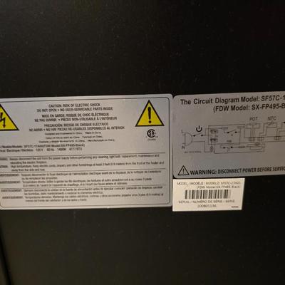 Working Space heater fireplace Model SF57C-17A00 with brown braided throw rug