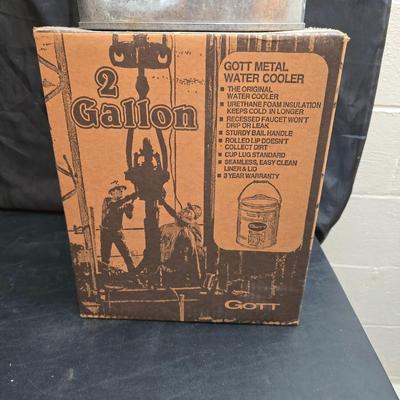 Two vintage Gott water coolers - 2 Gallon metal galvanized water cooler and a 2-gallon Gott blue plastic cooler