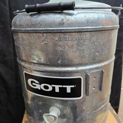 Two vintage Gott water coolers - 2 Gallon metal galvanized water cooler and a 2-gallon Gott blue plastic cooler
