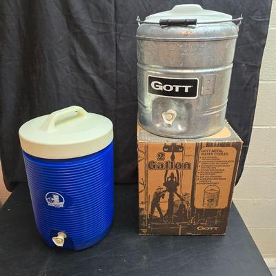 Two vintage Gott water coolers - 2 Gallon metal galvanized water cooler and a 2-gallon Gott blue plastic cooler