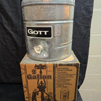 Two vintage Gott water coolers - 2 Gallon metal galvanized water cooler and a 2-gallon Gott blue plastic cooler