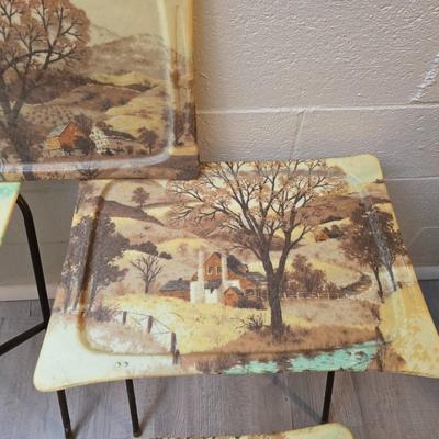 Vintage set of 3 complete fiberglass TV trays from the 1960s, featuring a rustic "Log Cabin" or country scene pattern likely...