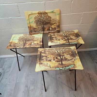 Vintage set of 3 complete fiberglass TV trays from the 1960s, featuring a rustic "Log Cabin" or country scene pattern likely...