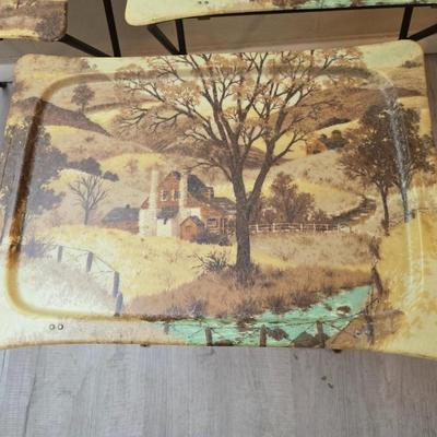 Vintage set of 3 complete fiberglass TV trays from the 1960s, featuring a rustic "Log Cabin" or country scene pattern likely...