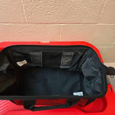 Craftsman storage tote, canvas Craftsman tool bag, red water coolers, and a 3 a day lunch cooler / bag