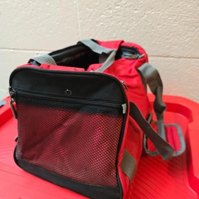 Craftsman storage tote, canvas Craftsman tool bag, red water coolers, and a 3 a day lunch cooler / bag
