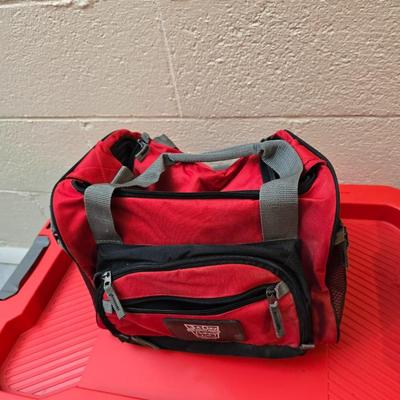 Craftsman storage tote, canvas Craftsman tool bag, red water coolers, and a 3 a day lunch cooler / bag