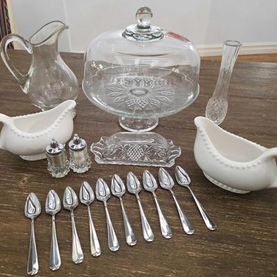 Sale Photo Thumbnail #88: This is a lot including a glass cake stand with dome, glass butter dish, crystal salt and pepper shakers, glass tea pitcher, crystal bud vase, 2 white gravy bowls and 10 grapefruit spoons. These are mostly all unmarked items. You are bidding on the lot me