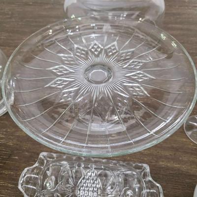 Sale Photo Thumbnail #93: This is a lot including a glass cake stand with dome, glass butter dish, crystal salt and pepper shakers, glass tea pitcher, crystal bud vase, 2 white gravy bowls and 10 grapefruit spoons. These are mostly all unmarked items. You are bidding on the lot me