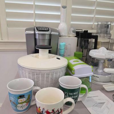 Sale Photo Thumbnail #96: This is a lot including a Keurig coffee maker, Cuisinart food processor, salad mixer, grinder, coffee cups and other miscellaneous items. You are bidding on the lot meaning you must pay for and take the entire lot.