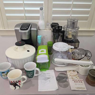 Sale Photo Thumbnail #95: This is a lot including a Keurig coffee maker, Cuisinart food processor, salad mixer, grinder, coffee cups and other miscellaneous items. You are bidding on the lot meaning you must pay for and take the entire lot.