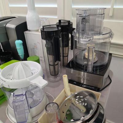 Sale Photo Thumbnail #98: This is a lot including a Keurig coffee maker, Cuisinart food processor, salad mixer, grinder, coffee cups and other miscellaneous items. You are bidding on the lot meaning you must pay for and take the entire lot.
