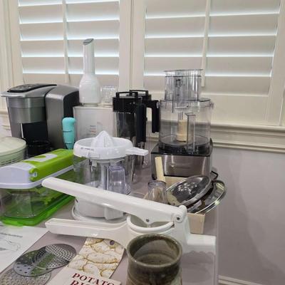 Sale Photo Thumbnail #97: This is a lot including a Keurig coffee maker, Cuisinart food processor, salad mixer, grinder, coffee cups and other miscellaneous items. You are bidding on the lot meaning you must pay for and take the entire lot.